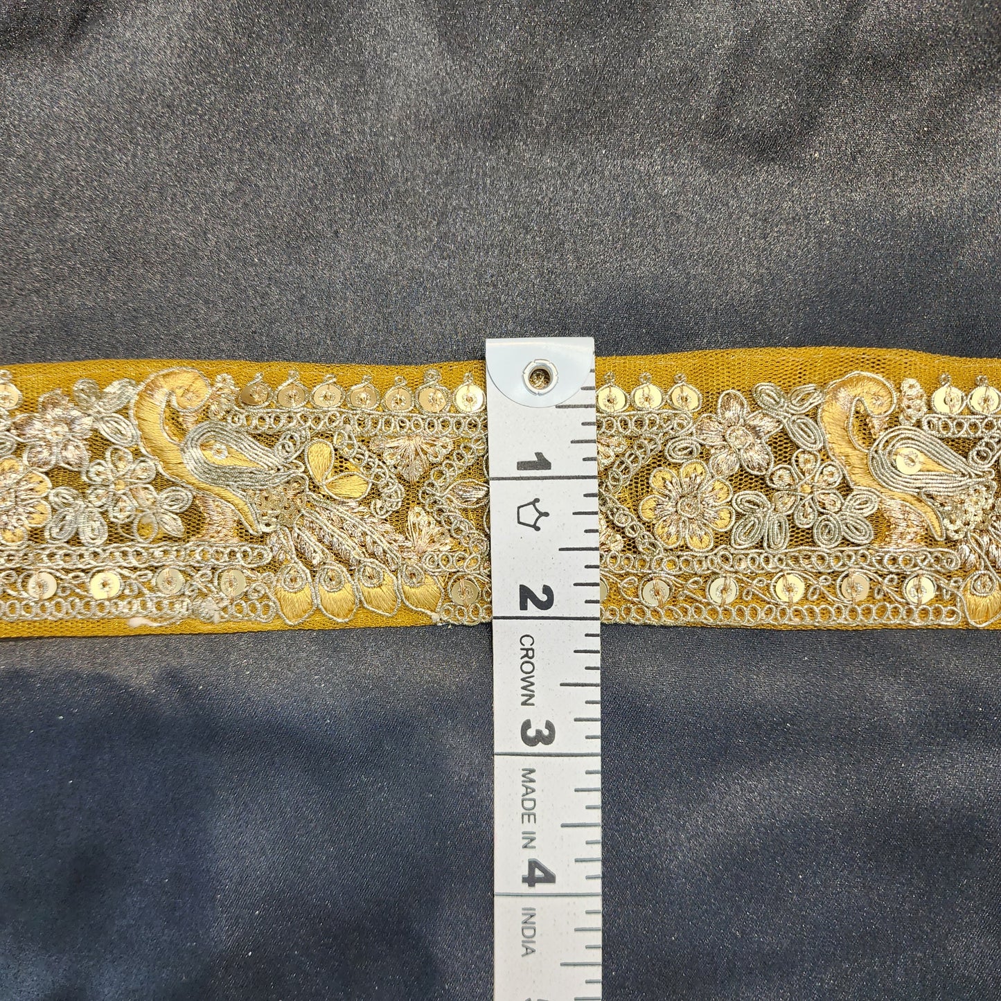 Yellow color Zari lace with peacock design