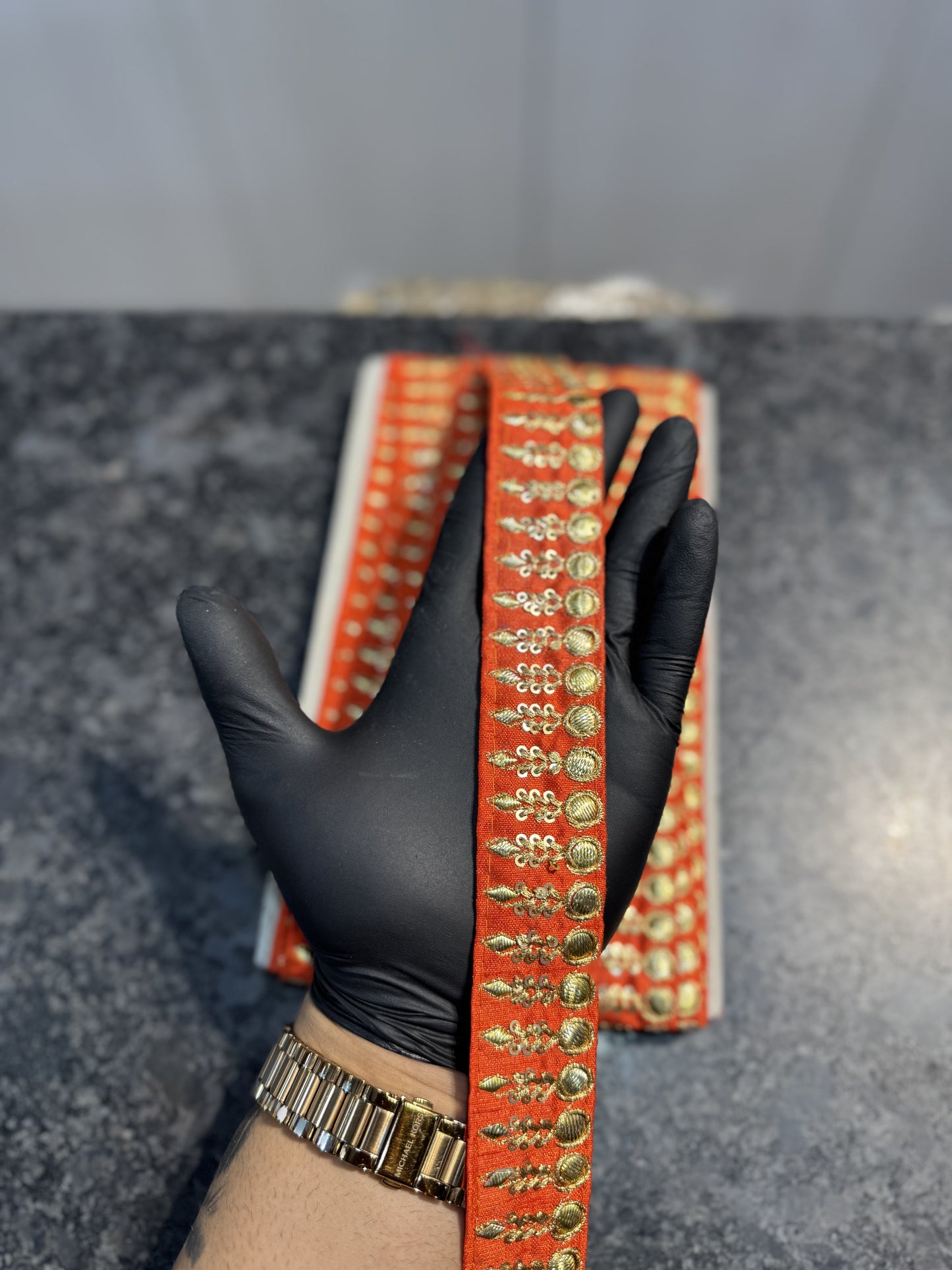Orange Color lace with golden work 9 meters approx.