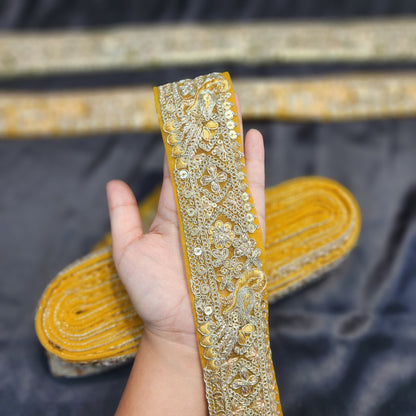 Yellow color Zari lace with peacock design