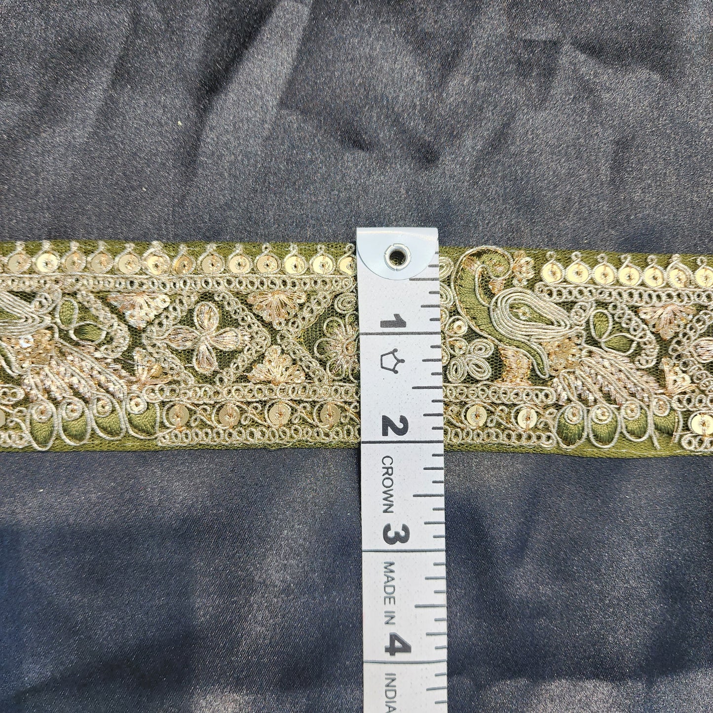 Green color Zari lace with peacock design